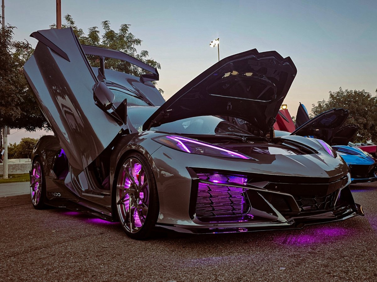 cool black and purple car at a car show