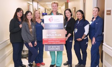 Recognition for stroke care, team posing for photo