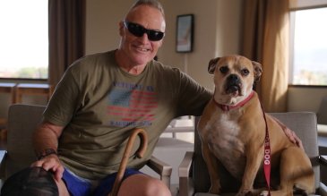 Patient and Veteran Kipp Petry, with service dog Maggie