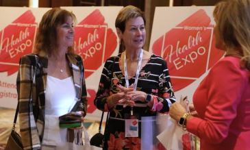 Three women talking at the expo