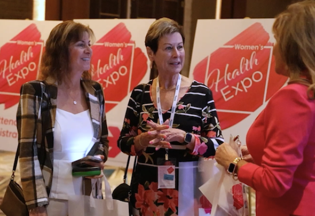 Three women talking at the expo