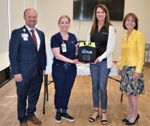 SWH Temecula and Michelle's Place staff posing with donated AED
