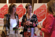 Three women talking at the expo