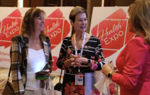 Three women talking at the expo